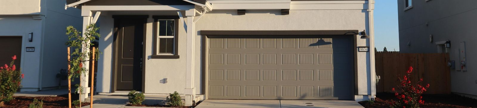 Modern Home and Garage Door – FAQ Page Conroe TX Contemporary Conroe TX house with tan garage door for garage door repair FAQ section
