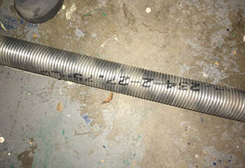 Garage door torsion spring visibly snapped on Atascocita home garage door