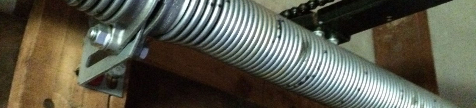 Garage door torsion spring visibly snapped on Atascocita home garage door
